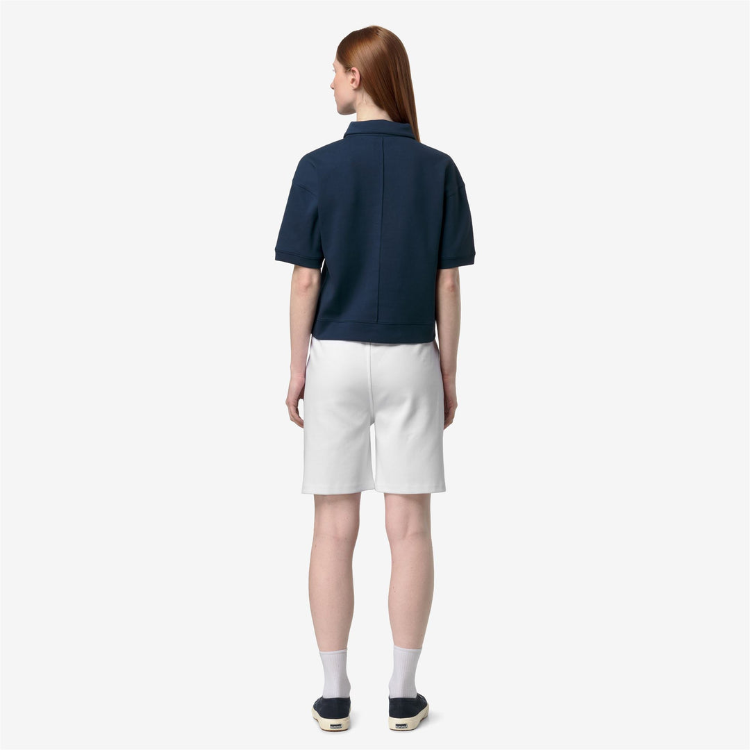 Polo deportivo azul para mujer con cuello con cremallera y corte relajado main