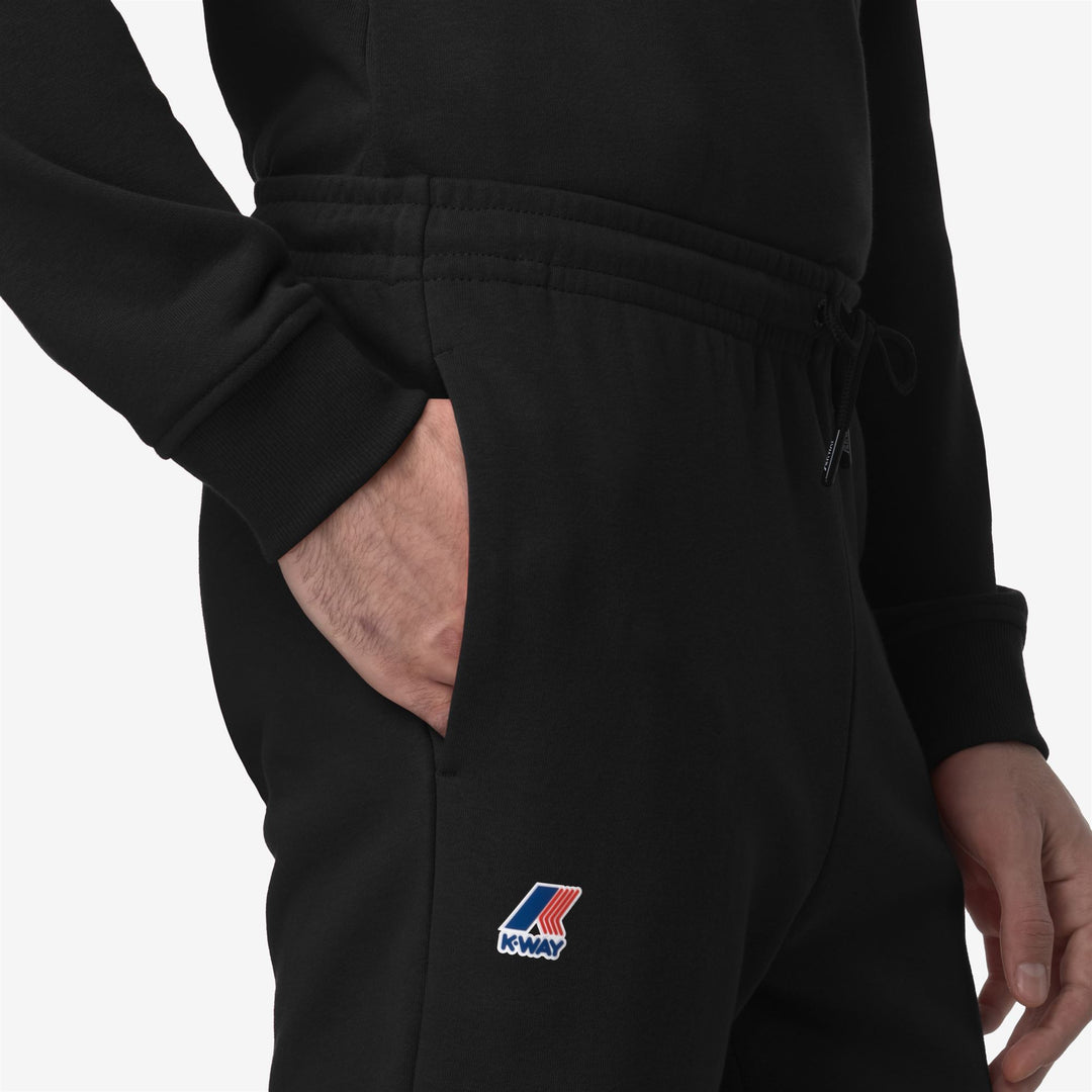 Pantalones de chándal ligeros unisex en negro y gris con bolsillos tipo snap main