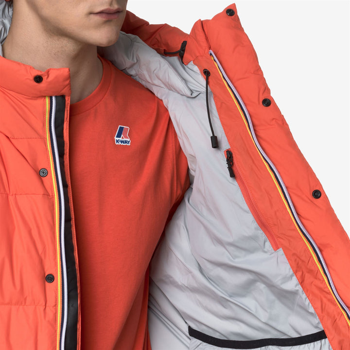 Chaqueta de plumón unisex naranja para mayor calidez y protección contra el clima invernal. 2