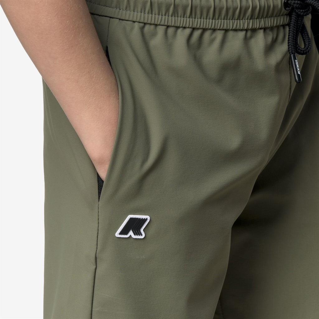 Shorts_Kid unisex_P. NESILIER TRAVEL_Sport Shorts_Green Lichen - Commercial 7