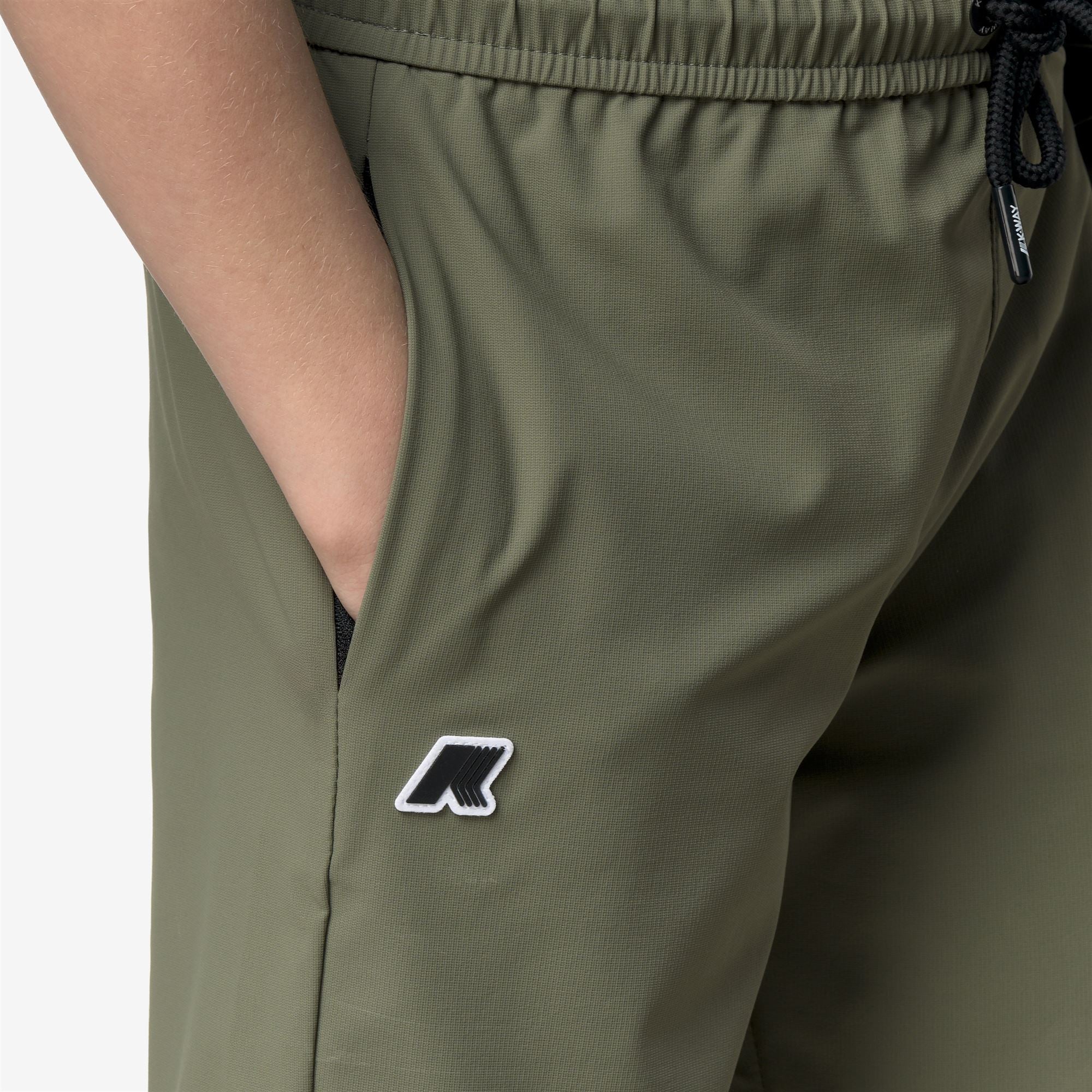 Shorts_Kid unisex_P. NESILIER TRAVEL_Sport Shorts_Green Lichen - Commercial 7