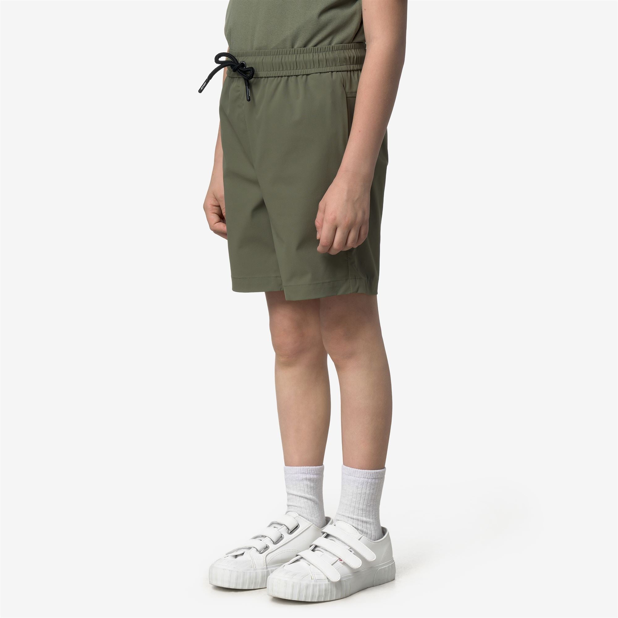 Shorts_Kid unisex_P. NESILIER TRAVEL_Sport Shorts_Green Lichen - Commercial 5