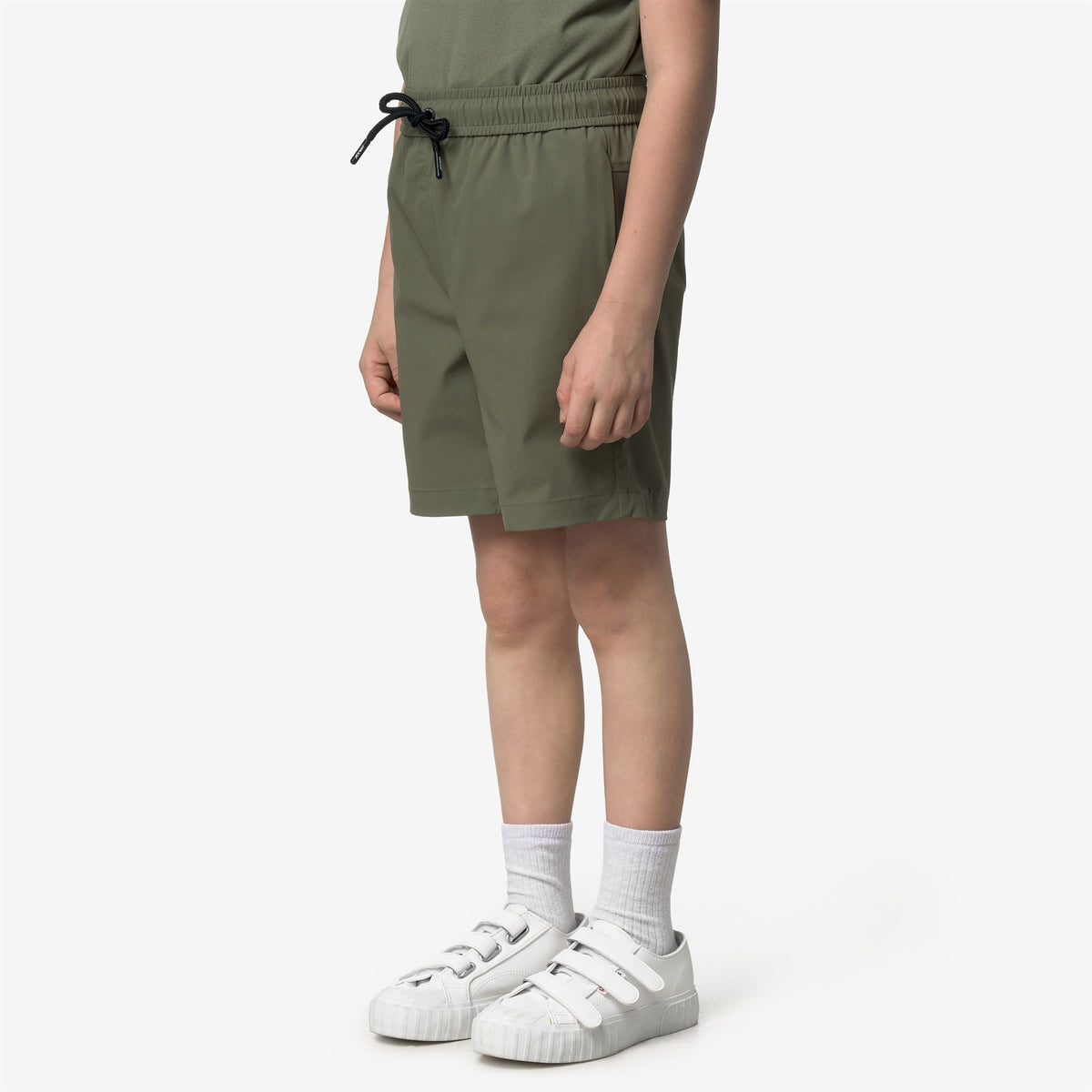 Shorts_Kid unisex_P. NESILIER TRAVEL_Sport Shorts_Green Lichen - Commercial 5